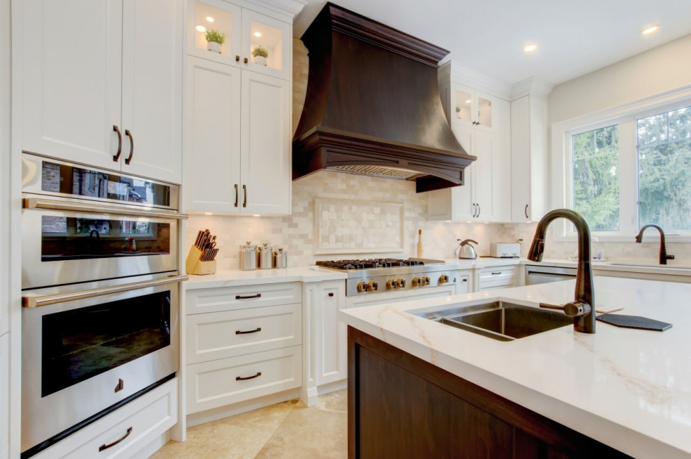 Example of a transitional kitchen design in Toronto