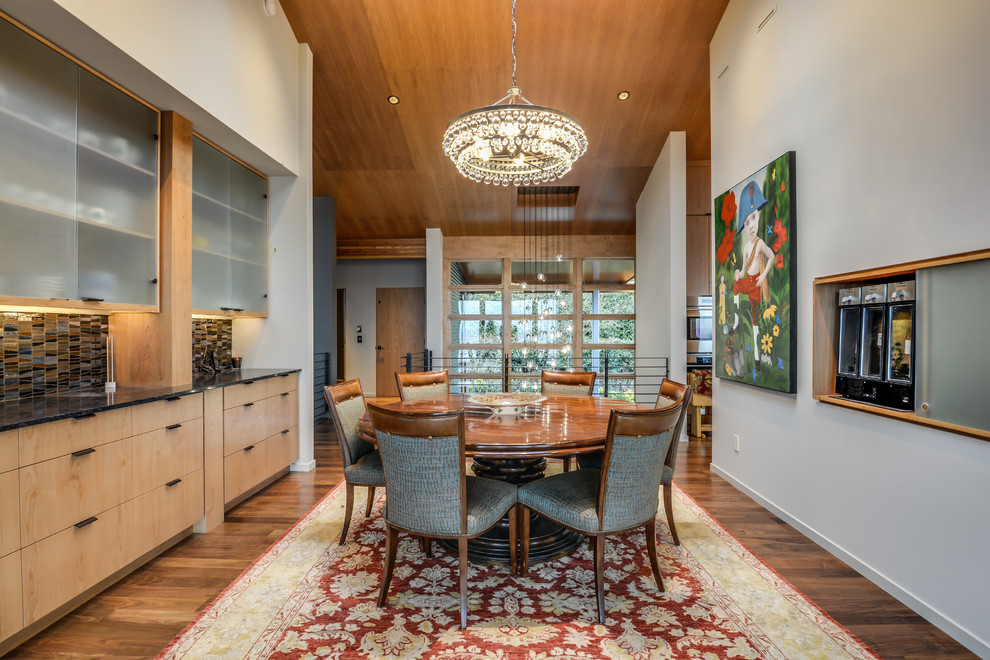 Enclosed dining room - mid-sized modern dark wood floor enclosed dining room idea in Seattle with white walls and no fireplace