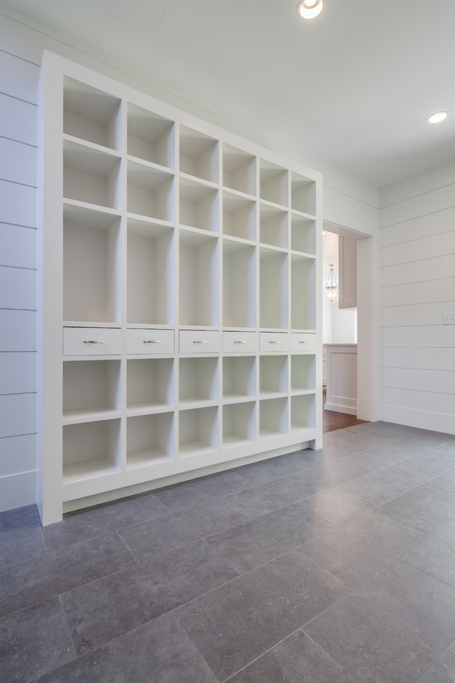 Inspiration for a huge transitional gray floor mudroom remodel with white walls