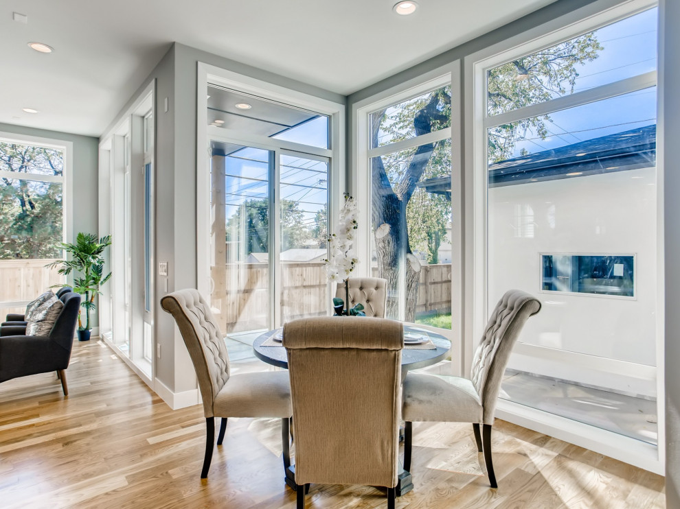 Breakfast nook - mid-sized contemporary light wood floor and brown floor breakfast nook idea in Denver with gray walls and no fireplace