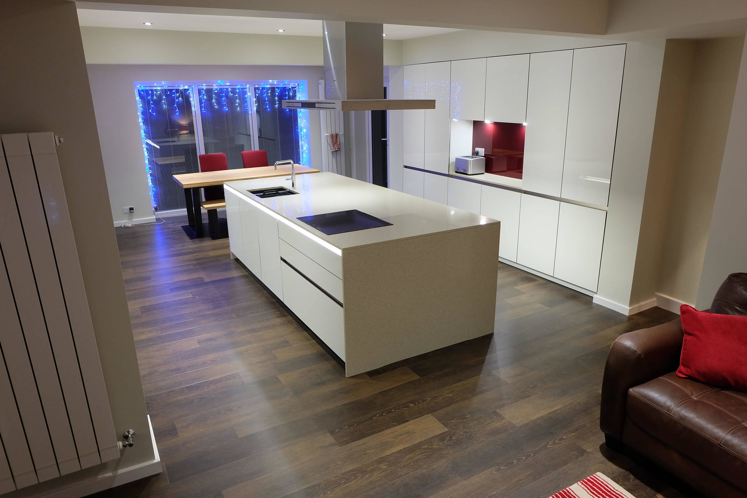 White Gloss Handleless Keller Kitchen with Brescia Stone Work Surfaces