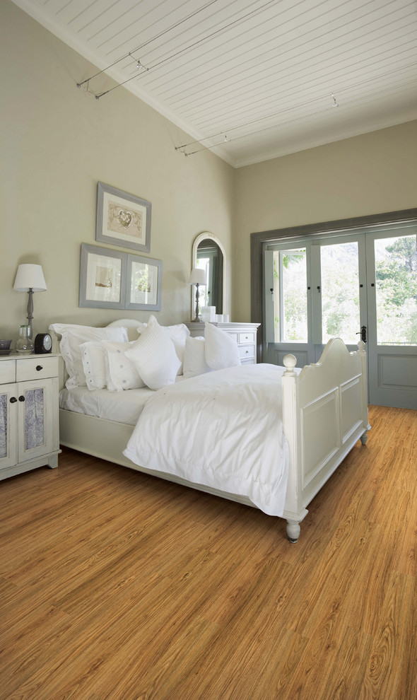 Photo of a traditional bedroom in Other with vinyl floors.