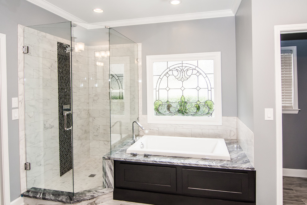 Design ideas for a large modern master bathroom in Atlanta with an undermount sink, shaker cabinets, black cabinets, marble benchtops, a drop-in tub, a corner shower, white tile, porcelain tile, grey walls and porcelain floors.