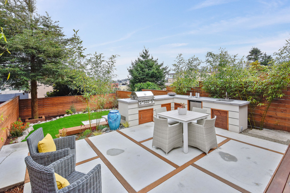 Inspiration for a mid-sized contemporary backyard patio in San Francisco with concrete pavers.