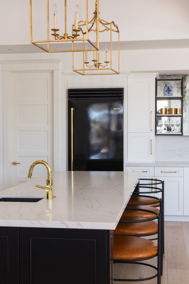 Large transitional kitchen photo in Orange County with black appliances