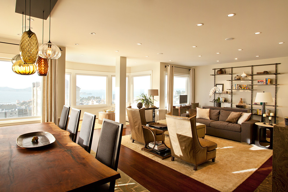 Contemporary open concept living room in San Francisco with beige walls, dark hardwood floors, no fireplace, no tv and brown floor.