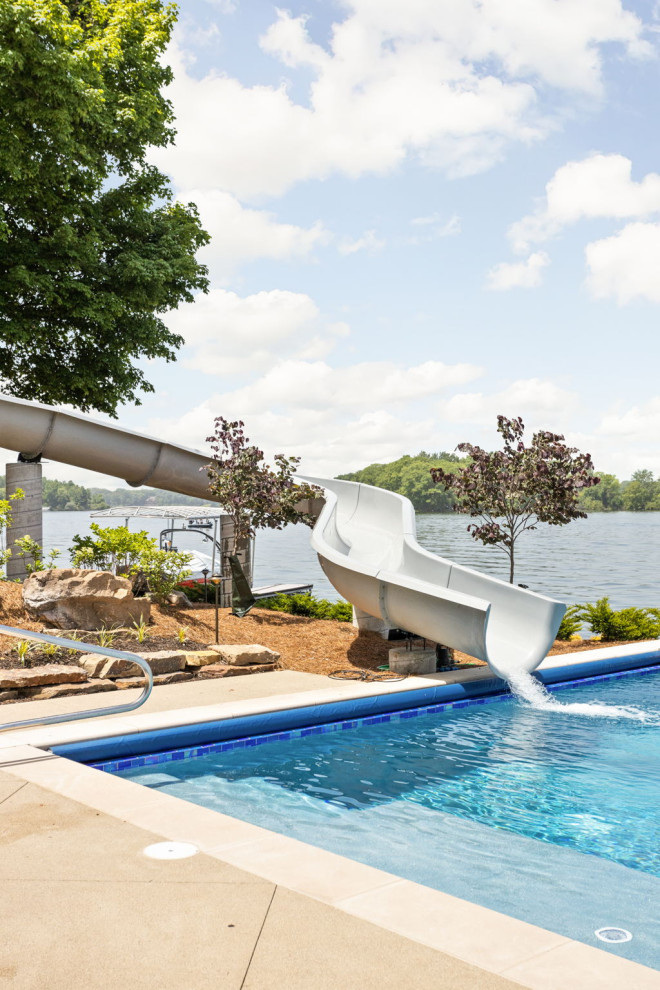 Inspiration for a modern backyard concrete paver and rectangular water slide remodel in Indianapolis