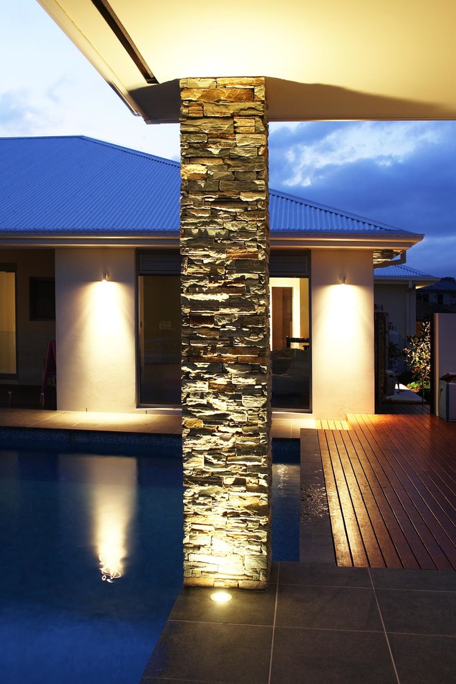 This is an example of an expansive modern backyard pool in Sydney.