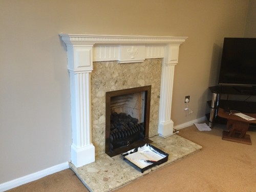 Before and After fireplace surround painting. Before : A really dark wood
