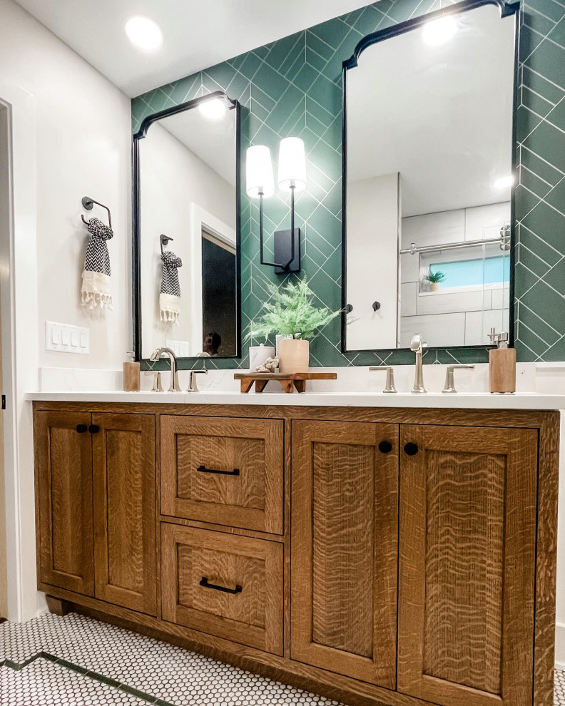 This is an example of a mid-sized country master bathroom in Chicago with shaker cabinets, medium wood cabinets, an alcove shower, a two-piece toilet, white tile, porcelain tile, green walls, ceramic floors, an undermount sink, engineered quartz benchtops, yellow floor, a sliding shower screen, white benchtops, a niche, a double vanity, a built-in vanity and wallpaper.