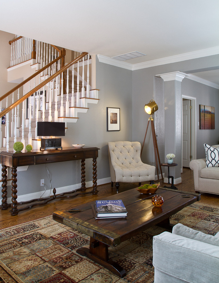 This is an example of a traditional living room in Austin with grey walls.