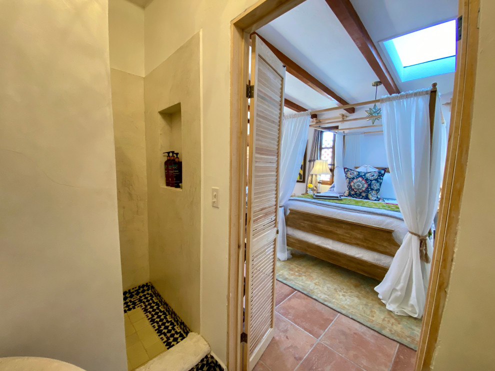 Small mediterranean shower room bathroom in San Diego with distressed cabinets, a walk-in shower, a two-piece toilet, white walls, terracotta flooring, a vessel sink, marble worktops, orange floors, an open shower, beige worktops, a single sink, a freestanding vanity unit, exposed beams, louvered cabinets and blue tiles.