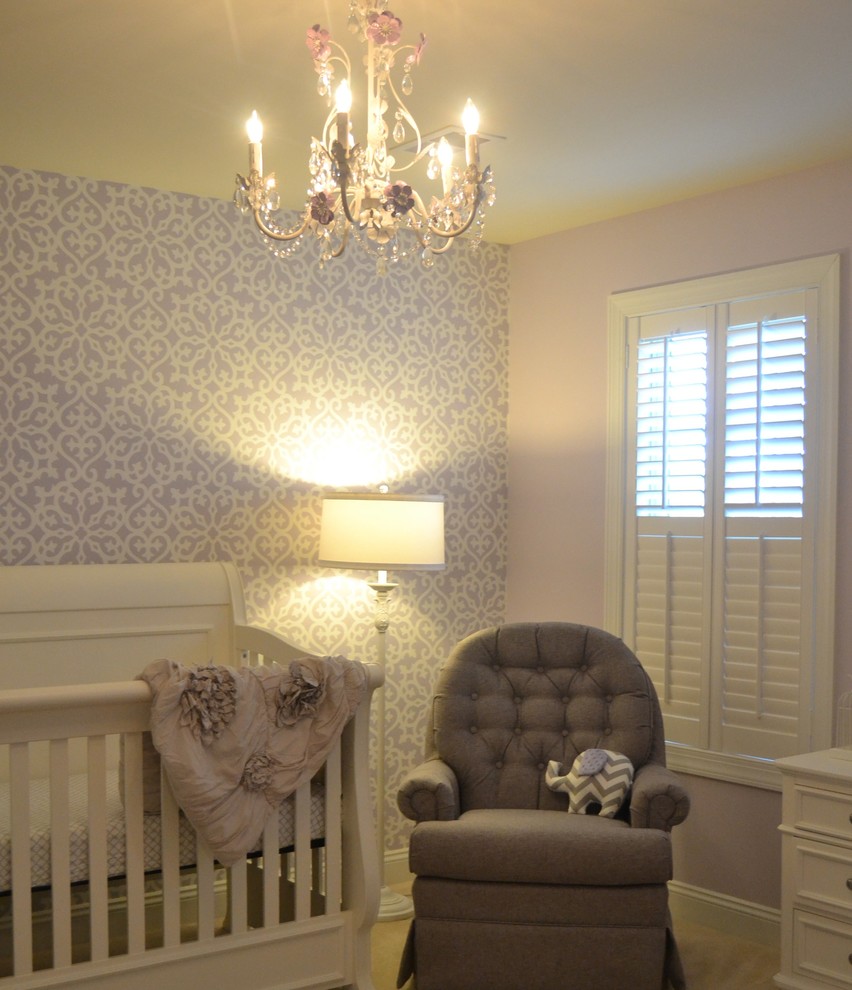 Photo of a mid-sized transitional nursery for girls in Philadelphia with grey walls, carpet and beige floor.