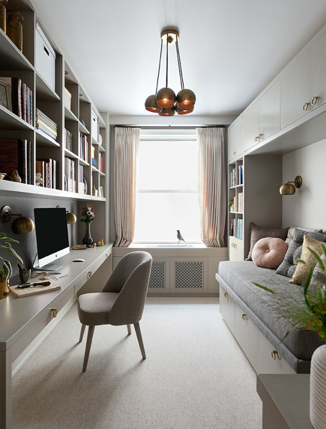 Inspiration for a small contemporary study room in New York with white walls, carpet, no fireplace and a built-in desk.