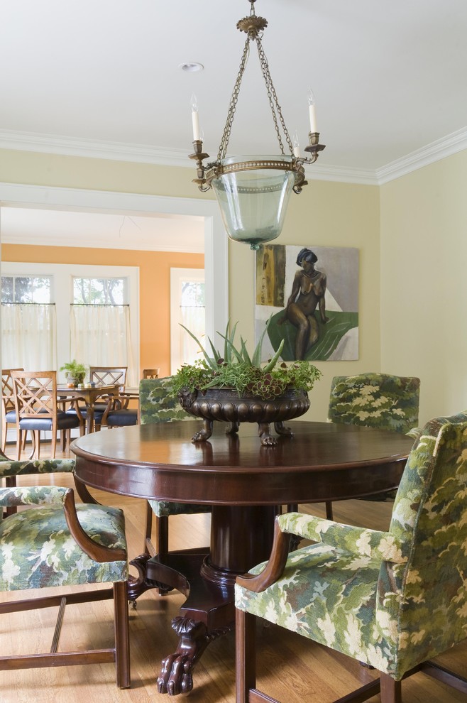 Photo of a traditional dining room in Newark with beige walls and medium hardwood floors.