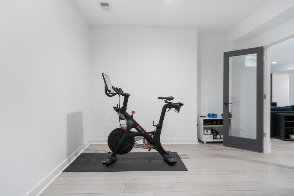 Home weight room - mid-sized modern vinyl floor and gray floor home weight room idea in San Diego with white walls