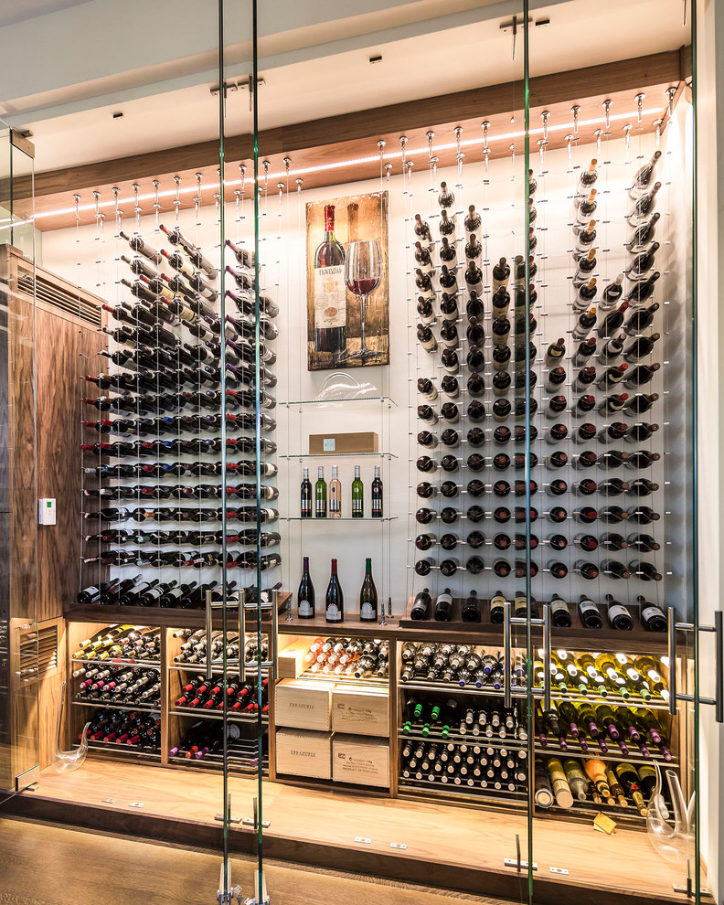 Photo of a contemporary wine cellar in Toronto.