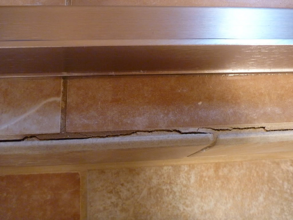 Help Pleasegrout cracking/tile separating in new bathroom