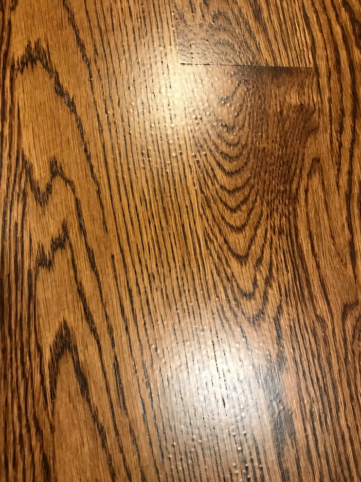 Hardwood flooring bubbles in finish