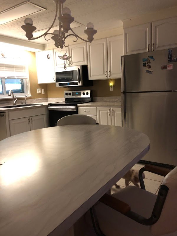 Inspiration for a small galley eat-in kitchen remodel with laminate countertops and no island