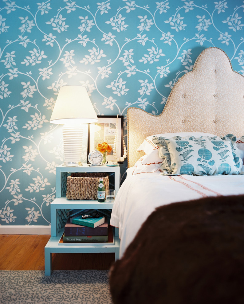 Inspiration for a traditional bedroom in New York with blue walls.