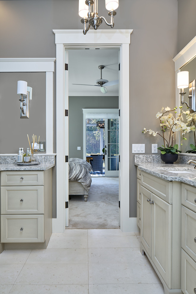 Inspiration for a mid-sized transitional master bathroom in Atlanta with shaker cabinets, grey cabinets, an alcove shower, a one-piece toilet, beige tile, porcelain tile, grey walls, porcelain floors, an undermount sink and granite benchtops.