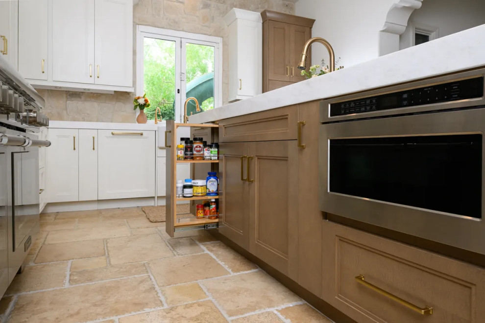 Eat-in kitchen - transitional u-shaped travertine floor and beige floor eat-in kitchen idea in Orange County with a farmhouse sink, shaker cabinets, white cabinets, quartz countertops, multicolored backsplash, stone tile backsplash, stainless steel appliances, an island and white countertops