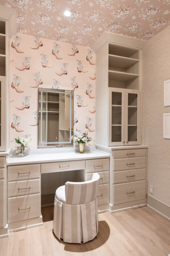 Inspiration for a coastal women's wallpaper ceiling built-in closet remodel in Nashville with flat-panel cabinets and light wood cabinets