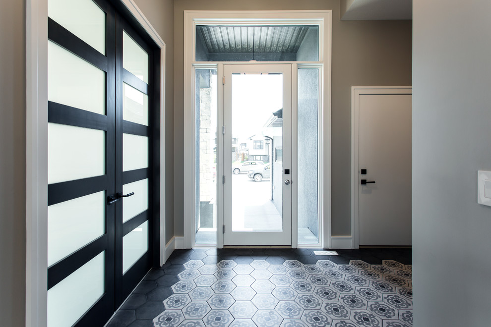 Inspiration for a mid-sized transitional porcelain tile and beige floor foyer remodel with gray walls and a white front door