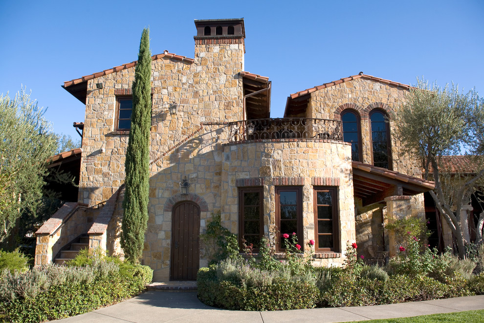 This is an example of a mediterranean exterior in Orange County with stone veneer.