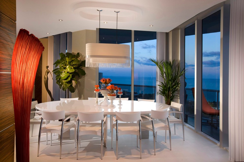 Photo of a modern dining room in Miami with beige walls.