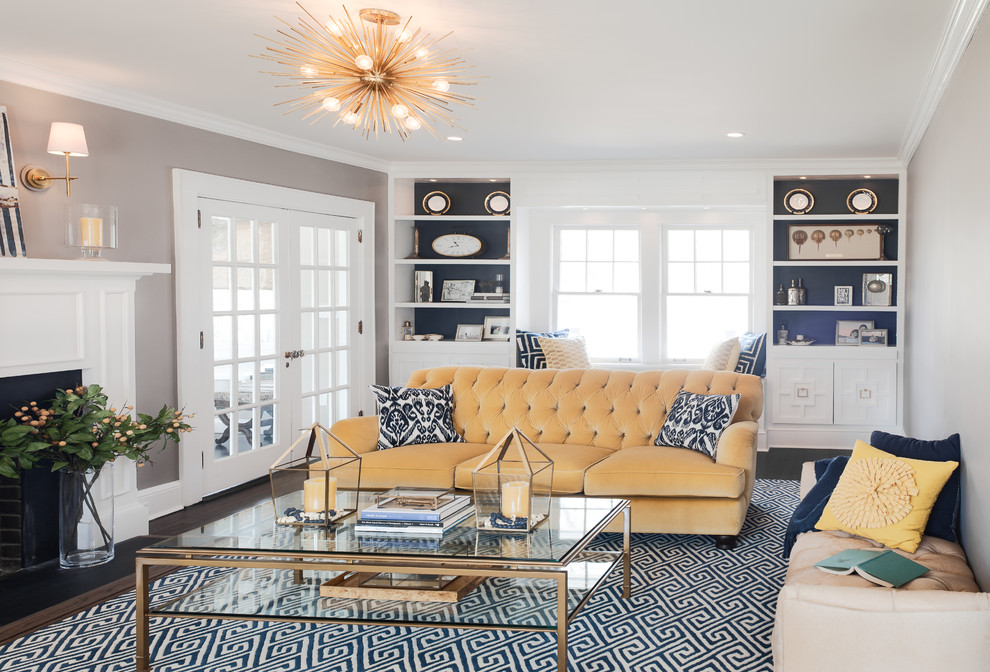 Inspiration for a mid-sized contemporary enclosed dark wood floor living room remodel in New York with gray walls, a standard fireplace, a stone fireplace and no tv