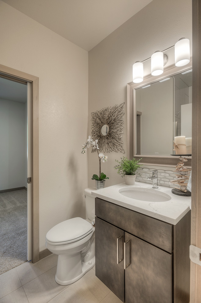 Photo of a small contemporary 3/4 bathroom in Seattle with flat-panel cabinets, grey cabinets, an alcove shower, a one-piece toilet, white tile, mosaic tile, white walls, linoleum floors, an undermount sink, granite benchtops, white floor and an open shower.