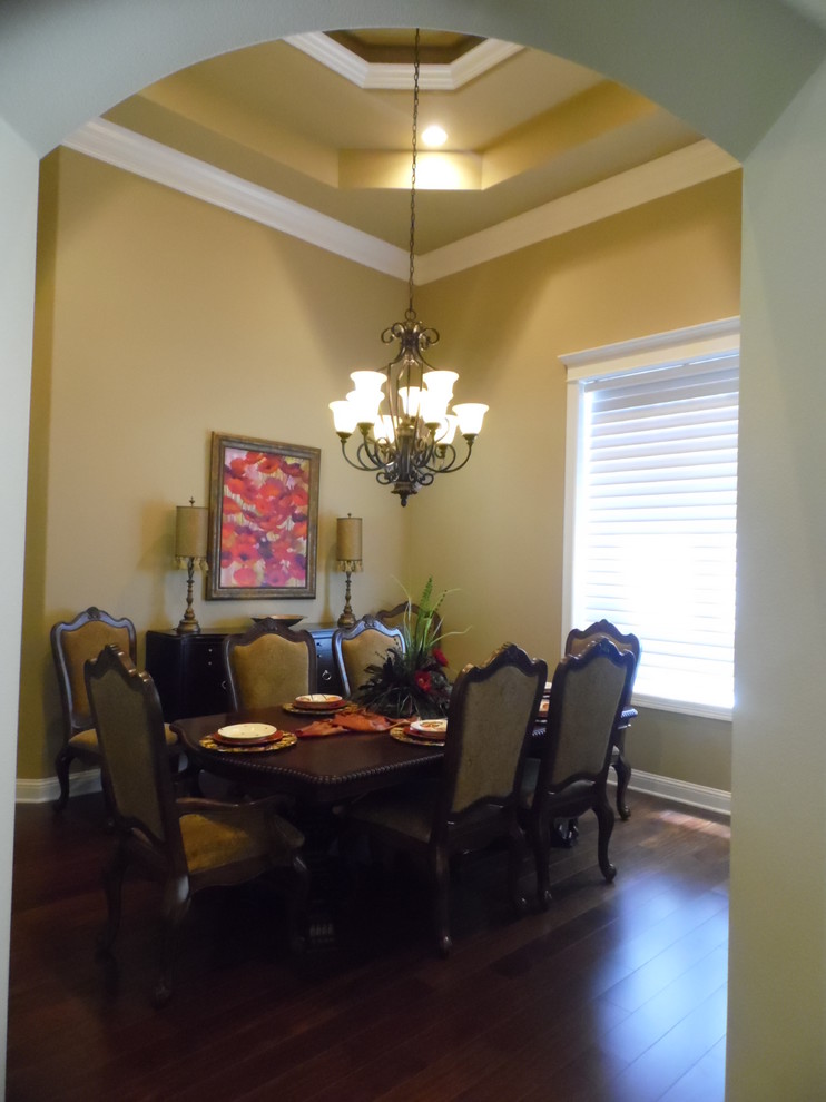 Large traditional open plan dining in Austin with beige walls and dark hardwood floors.