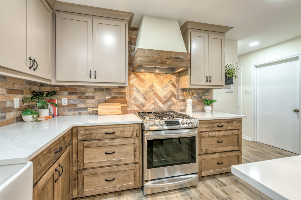 Eat-in kitchen - mid-sized rustic u-shaped porcelain tile and brown floor eat-in kitchen idea with an undermount sink, shaker cabinets, medium tone wood cabinets, quartzite countertops, multicolored backsplash, porcelain backsplash, stainless steel appliances, an island and white countertops
