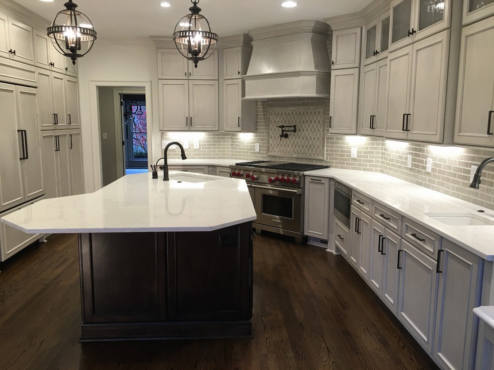 This is an example of a large transitional l-shaped kitchen pantry in Charlotte with beaded inset cabinets, grey cabinets, quartz benchtops, grey splashback and with island.