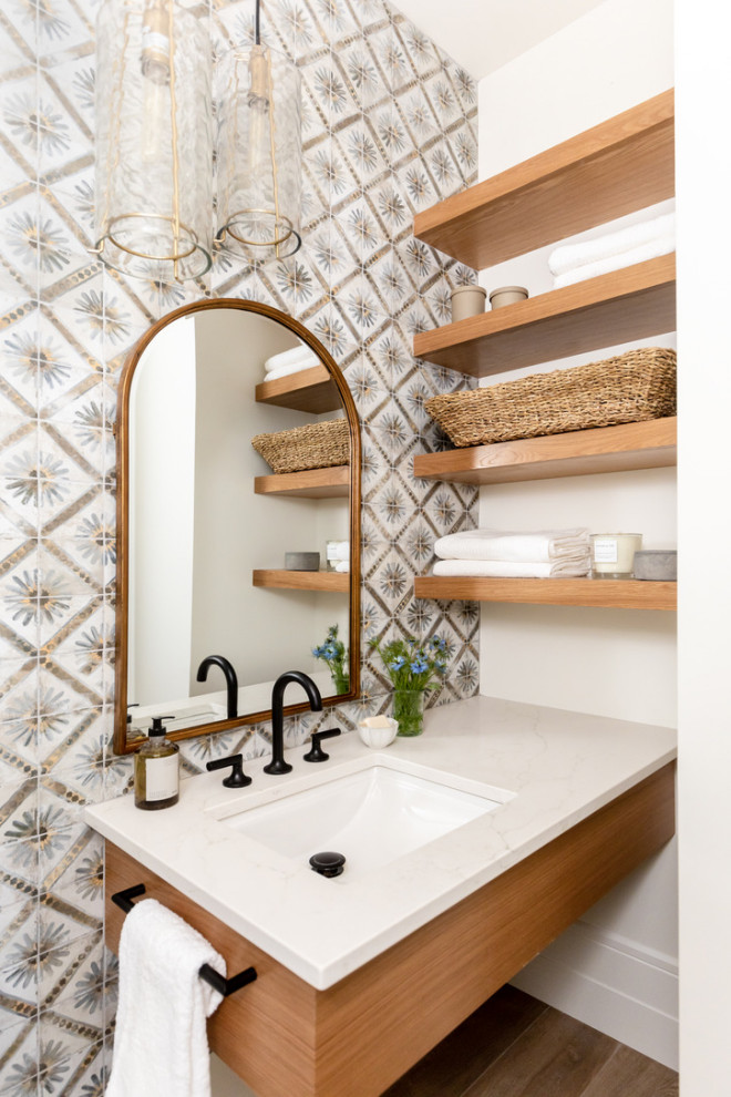 Design ideas for a small classic cloakroom in Salt Lake City with flat-panel cabinets, light wood cabinets, a one-piece toilet, multi-coloured tiles, ceramic tiles, white walls, porcelain flooring, a built-in sink, engineered stone worktops, beige floors, white worktops and a floating vanity unit.
