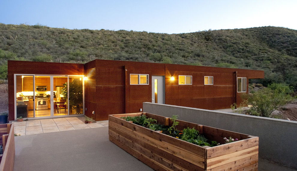 Design ideas for a country brown exterior in Phoenix with metal siding.