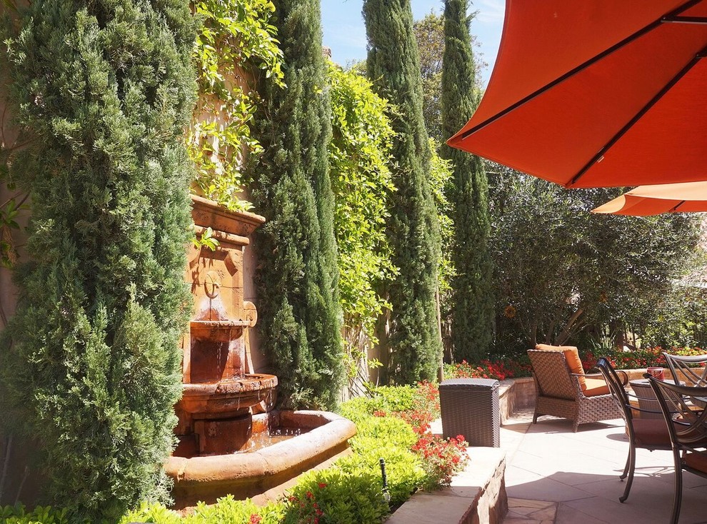 Inspiration for a large mediterranean courtyard formal garden in Orange County.