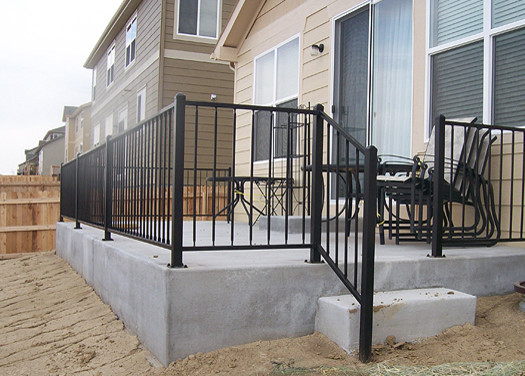 This is an example of a small contemporary backyard patio in Denver with concrete slab and no cover.