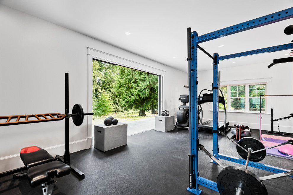Photo of a large traditional multipurpose gym in Seattle with white walls and black floor.