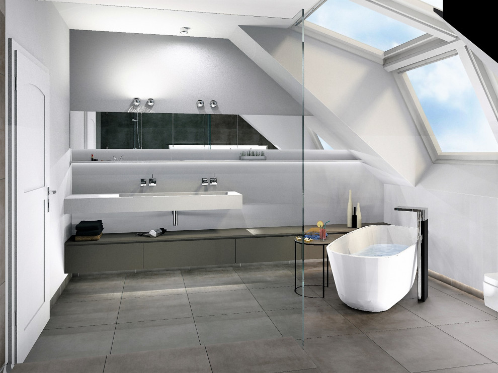 This is an example of a contemporary grey and white bathroom in Dusseldorf with flat-panel cabinets, grey cabinets, a freestanding bath, a walk-in shower, a wall mounted toilet, grey tiles, ceramic tiles, white walls, ceramic flooring, a wall-mounted sink, solid surface worktops, grey floors, an open shower, white worktops, double sinks and a floating vanity unit.