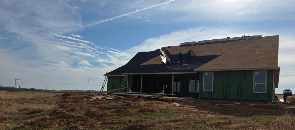 The rear of the home with covered patio under construction