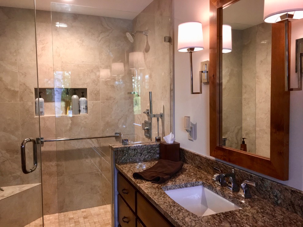 Design ideas for a mid-sized country master bathroom in Minneapolis with recessed-panel cabinets, brown cabinets, beige tile, porcelain floors, an undermount sink, quartzite benchtops, a hinged shower door, a corner tub, an open shower and mosaic tile.