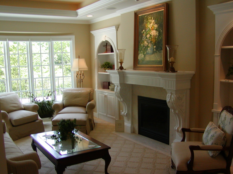 This is an example of a traditional living room in Grand Rapids with beige walls, carpet, a standard fireplace and a tile fireplace surround.