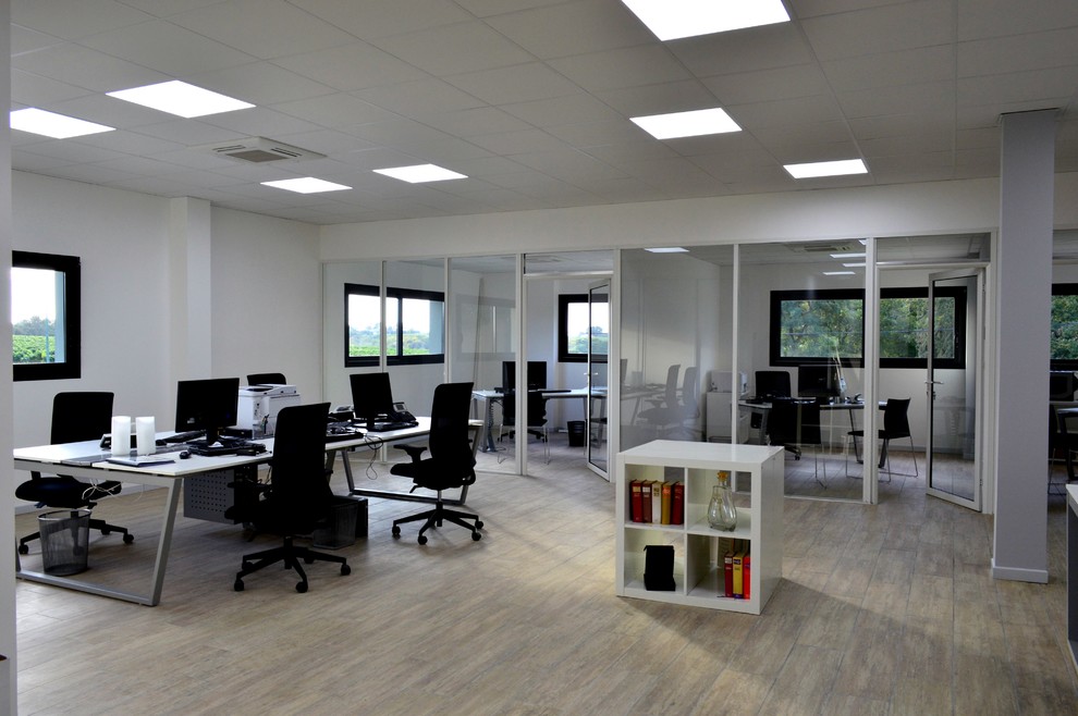 Large contemporary study room in Other with white walls, ceramic floors, a freestanding desk and beige floor.