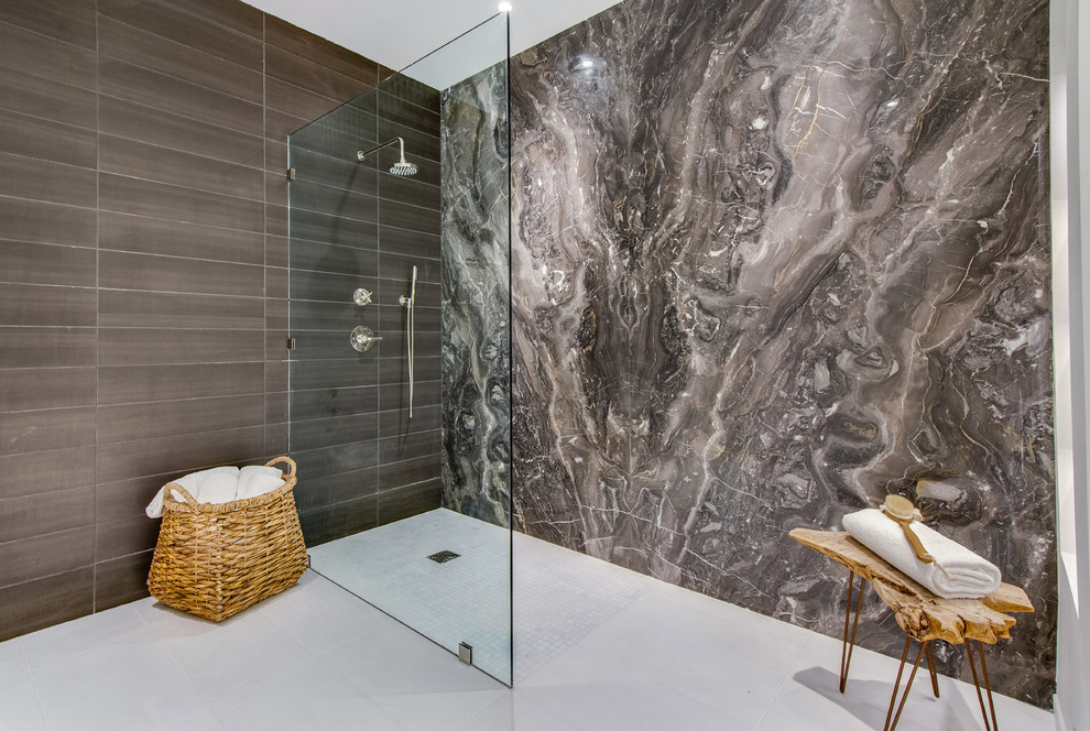 Photo of a contemporary master bathroom in Los Angeles with an open shower, multi-coloured tile, stone slab, white floor and an open shower.