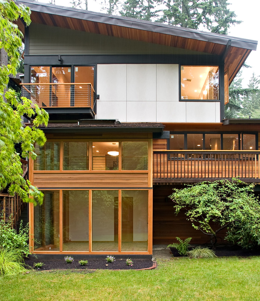 Photo of a contemporary exterior in Seattle with mixed siding.