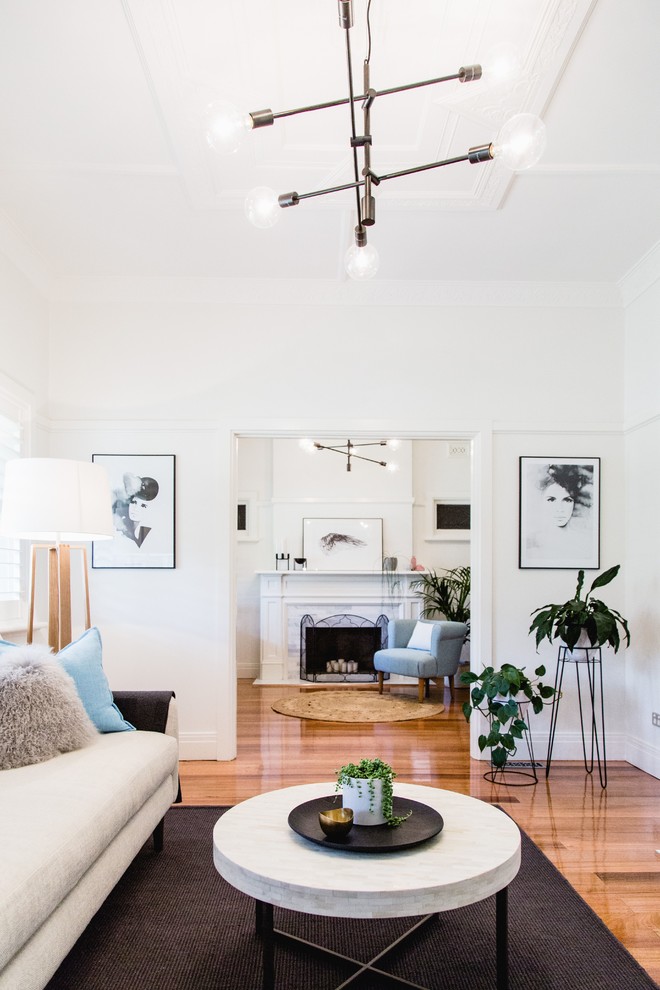Inspiration for a large scandinavian living room in Melbourne with white walls and medium hardwood floors.