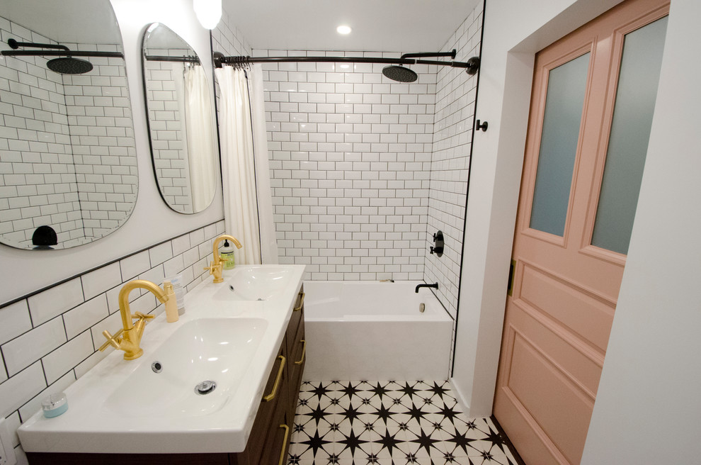 Photo of a mid-sized contemporary master bathroom in Toronto with shaker cabinets, medium wood cabinets, an alcove tub, a shower/bathtub combo, a one-piece toilet, white tile, ceramic tile, white walls, cement tiles, an integrated sink, solid surface benchtops, a shower curtain and white benchtops.